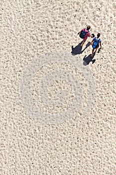 Aerial view of two male tourists walking on sand dune in Dueodde, Bornholm island, Denmark