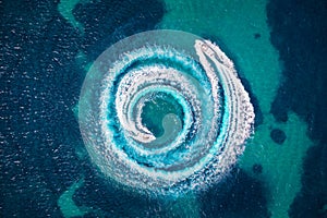 Aerial view of two motorboats over turquoise sea photo