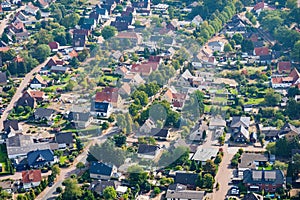 Aerial view of a typical German suburb with detached houses and close neighbourhood, flight with a gyroplane. photo