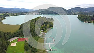 Aerial view on the upper ends of Ossiacher Lake in Carinthia, Austria on a summer day with great cloudscape