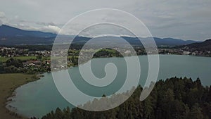 Aerial view on the upper ends of Ossiacher Lake in Carinthia, Austria on a summer day with great cloudscape