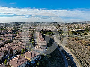 Aerial view of upper middle class neighborhood with identical residential subdivision house