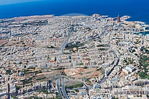 Aerial view of urban Malta. Tunnel on highway 1 under Ta ` Giorni town and Paceville district, parts of St. Julian`s San Giljan