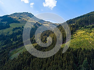 Aerial view into the valley head of the Hinterglemm Mountains on a summer day in the Alps at Saalbach-Hinterglemm