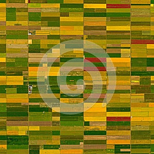 Aerial view of a vast agricultural landscape featuring a grid of rectangular fields in photo