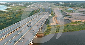 Aerial view of vehicles driving on Alfred E. Driscoll Bridge a huge complex road junction at the entrance for Sayreville