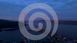 Aerial view of vehicles passing over Istanbul Yavuz Sultan Selim Bridge in sunrise light