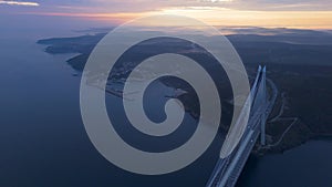 Aerial view of vehicles passing over Istanbul Yavuz Sultan Selim Bridge in sunrise light