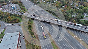 In aerial view, vehicles slowed down on a highway during rush hour because of heavy traffic jams