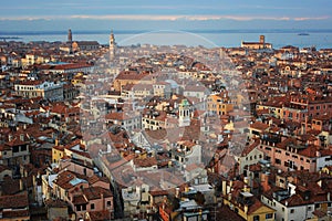 Aerial view of Venice roofs, old city and house buildings in Italy. Top view of traditional buildings in the center of Venice.