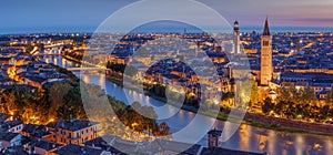 Aerial view of Verona city night cityscape and church Santa Anastasia, with Adige river , located in Veneto, Italy, viewed from photo