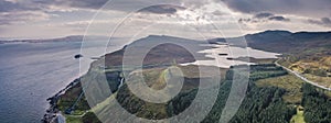 Aerial view of the very steep sea cliffs at Bearreraig Bay with the storr lochs in background - Isle of Skye , Scotland