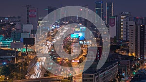 Aerial view of Via Expresa highway and metropolitan bus with traffic day to night timelapse. Lima, Peru