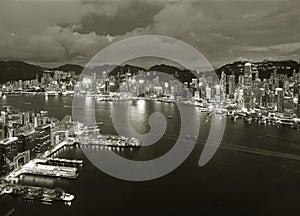 Aerial view of Victoria Harbor of Hong Kong city at dusk