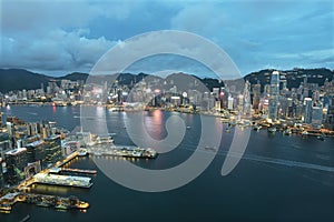 Aerial view of Victoria Harbor of Hong Kong city at dusk