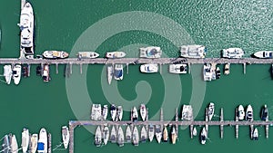 Aerial View video Drone shot of Yacht and sailboat parking in marina Transportation and travel background concept