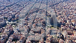 Aerial view video footage of residence districts in european city. Eixample district. Barcelona, Spain. Sagrada familia