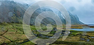 Aerial view of a viking village on a stormy rainy day in Iceland.