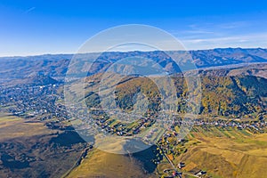 Aerial view of village and autumn mountain