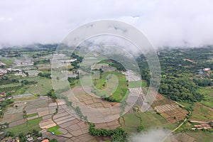 Aerial View of Village landscape and River over Clouds in Chiangdao , Thailand