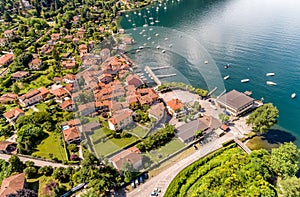 Aerial view of the village and the small harbor of Castelveccana, located on the shore of Lake Maggiore in the province of Varese. photo