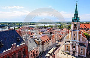 Aerial view of the Vistula  Wisla  river with bridge and historical buildings of the medieval city of Torun, Poland. August 2019