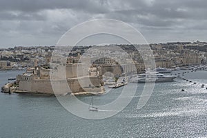 Aerial view of Vittoriosa, Malta, under a dramatic sky