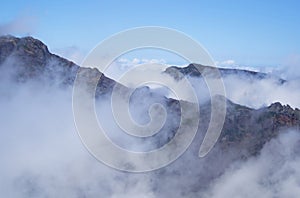 Aerial view of volcanic peaks emerging from the clouds, Pico do Arieiro, Madeira Portugal