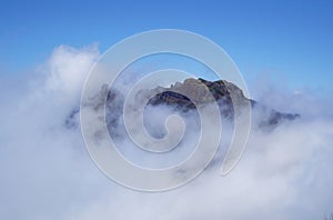 Aerial view of volcanic peaks emerging from the clouds, Pico do Arieiro, Madeira Portugal