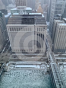 Aerial view of Wacker Drive, el tracks, and cracked ice on Chicago River