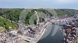 Aerial view of Walloon city of Dinant located along Meuse river with Gothic medieval Collegiate Church of Our Lady and
