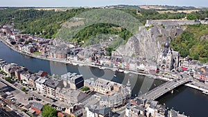 Aerial view of Walloon city of Dinant located along Meuse river with Gothic medieval Collegiate Church of Our Lady and