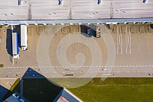 Aerial view of warehouse storages or industrial factory or logistics center from above. Aerial view of industrial buildings and