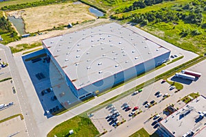 Aerial view of warehouse storages or industrial factory or logistics center from above. Aerial view of industrial buildings and