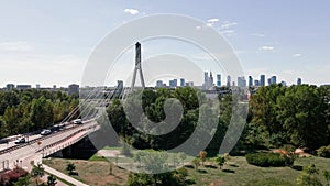 Aerial view of Warsaw cityscape with skyscrapers and bridge over river