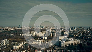 Aerial view of Warsaw suburbs and distant dowtown skyline on sunny spring day, Poland photo