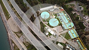 Aerial view of waste water treatment plant. Outdoor site with multiple wastewater plants