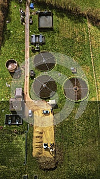 Aerial view of a wastewater treatment facility with circular tanks amidst green fields in North Yorkshire