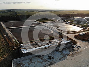 Aerial view of wastewater treatment plant at sunset, filtration of dirty or sewage water.