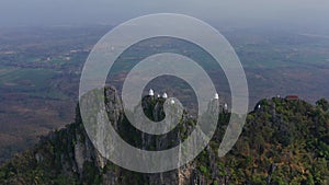 Aerial view of Wat Chaloem Phra Kiat Phrachomklao Rachanusorn, sky pagodas on top of mountain in Lampang Thailand