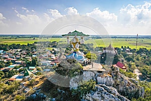 Aerial view of Wat Khao Samo Khon temple, with hanuman monkey god statue on top of mountain, in Lopburi, Thailand photo