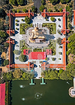 Aerial view of Wat Pikul Thong Phra Aram Luang or Wat Luang Por Pae temple with giant Buddha, in Sing Buri, Thailand