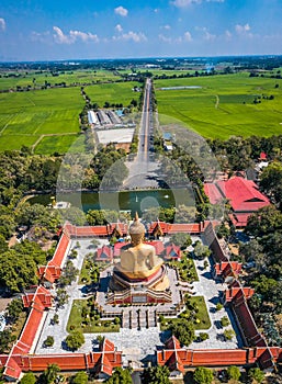 Aerial view of Wat Pikul Thong Phra Aram Luang or Wat Luang Por Pae temple with giant Buddha, in Sing Buri, Thailand