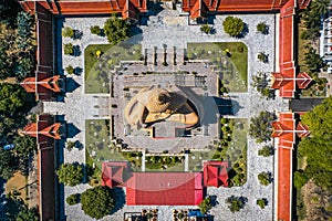 Aerial view of Wat Pikul Thong Phra Aram Luang or Wat Luang Por Pae temple with giant Buddha, in Sing Buri, Thailand