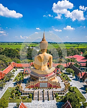 Aerial view of Wat Pikul Thong Phra Aram Luang or Wat Luang Por Pae temple with giant Buddha, in Sing Buri, Thailand