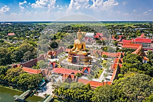 Aerial view of Wat Pikul Thong Phra Aram Luang or Wat Luang Por Pae temple with giant Buddha, in Sing Buri, Thailand