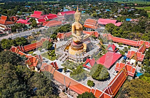 Aerial view of Wat Pikul Thong Phra Aram Luang or Wat Luang Por Pae temple with giant Buddha, in Sing Buri, Thailand