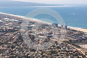 Aerial view of a water reclamation plant and beach on the Pacific Ocean