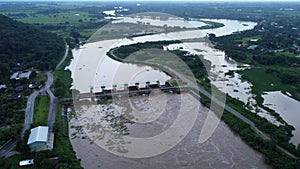 Aerial view of the water released from the concrete dam\'s drainage channel as the overflow in the rainy season.