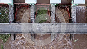 Aerial view of water released from the drainage channel of the concrete dam is a way of overflowing water in the rainy season.